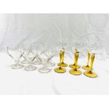 A set of six hock glasses , together with six wine glasses