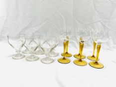 A set of six hock glasses , together with six wine glasses