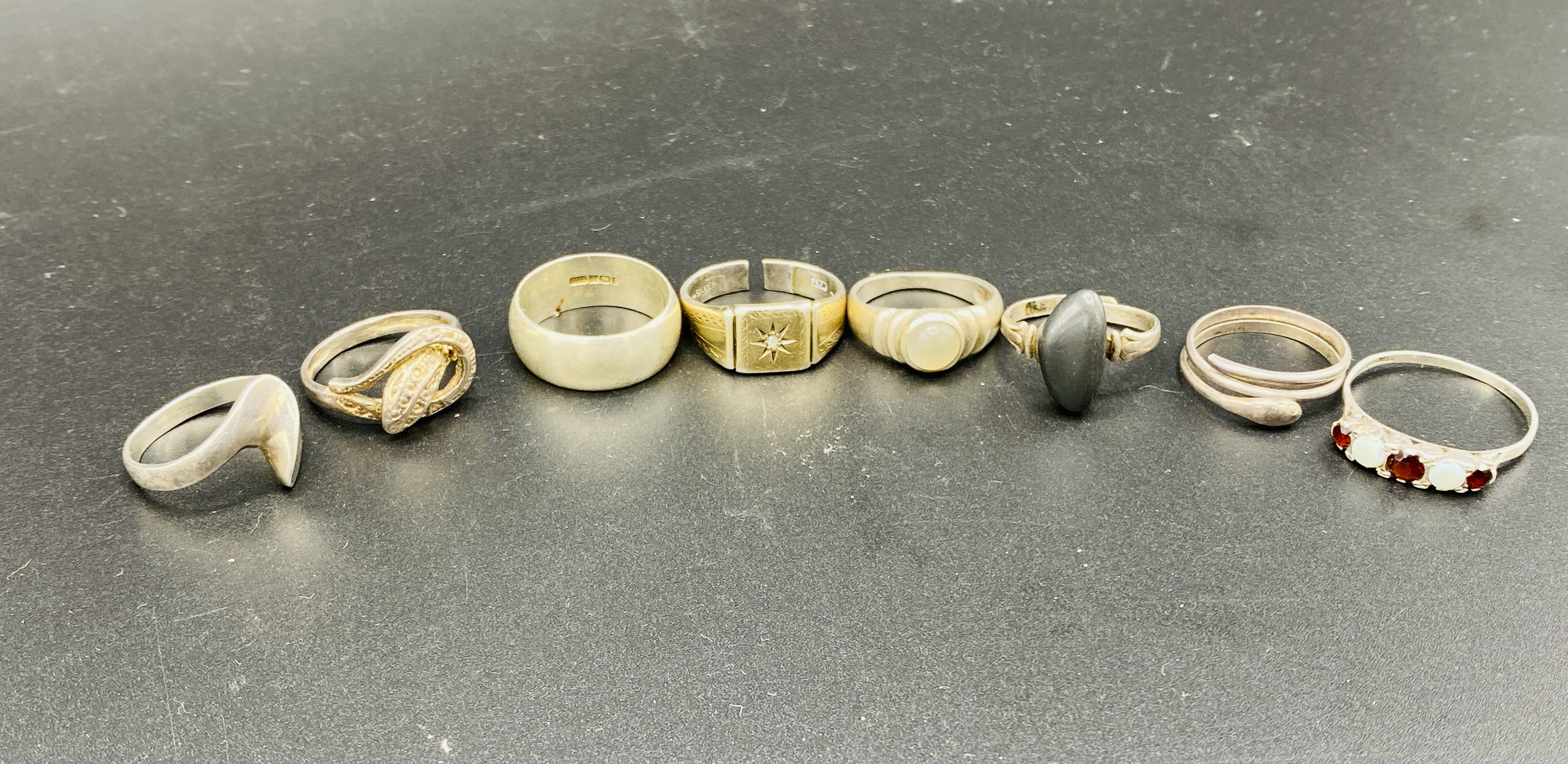 Eight assorted silver rings