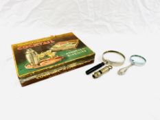 A silver handled magnifying glass, a 'Metropolitan' whistle and other items