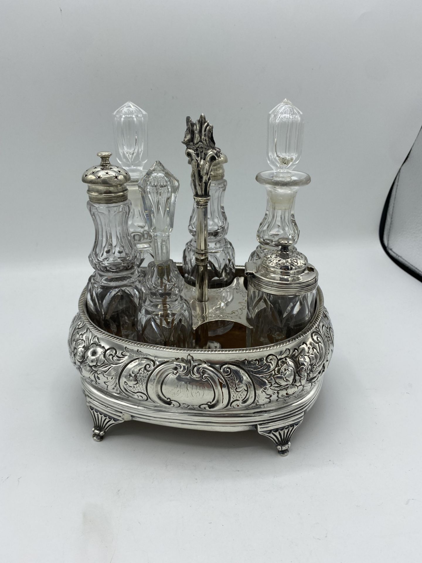 Silver mounted cruet frame, together with six cut glass cruet bottles