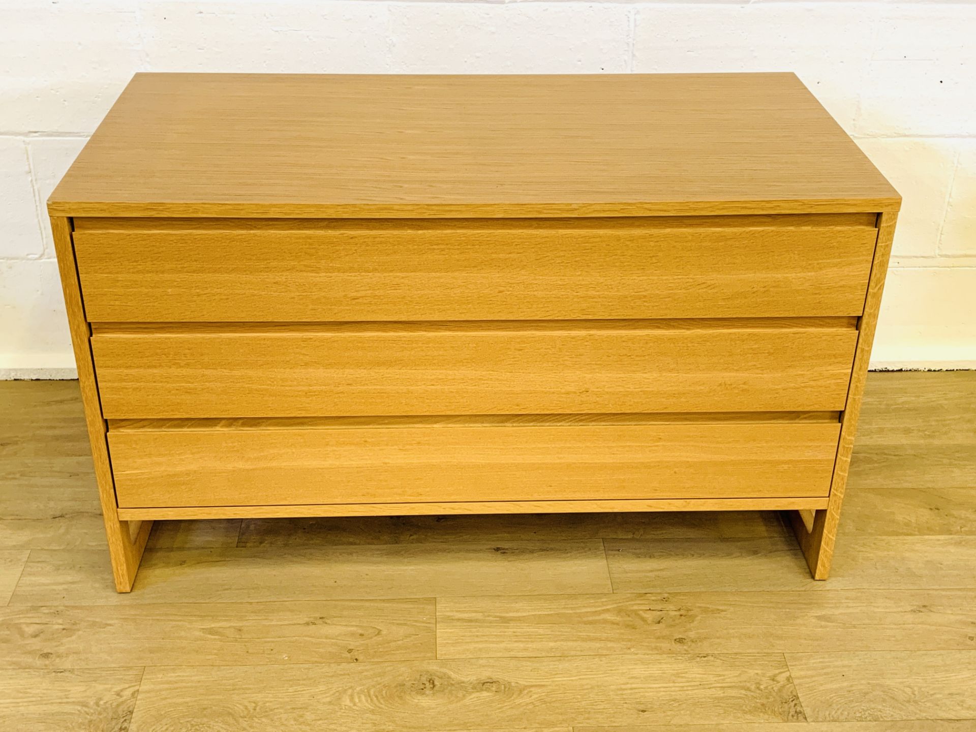 Oak veneer chest of three drawers