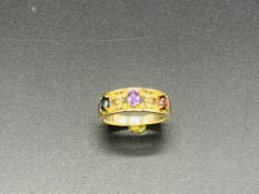 9ct gold ring set with red, blue and pale purple stones