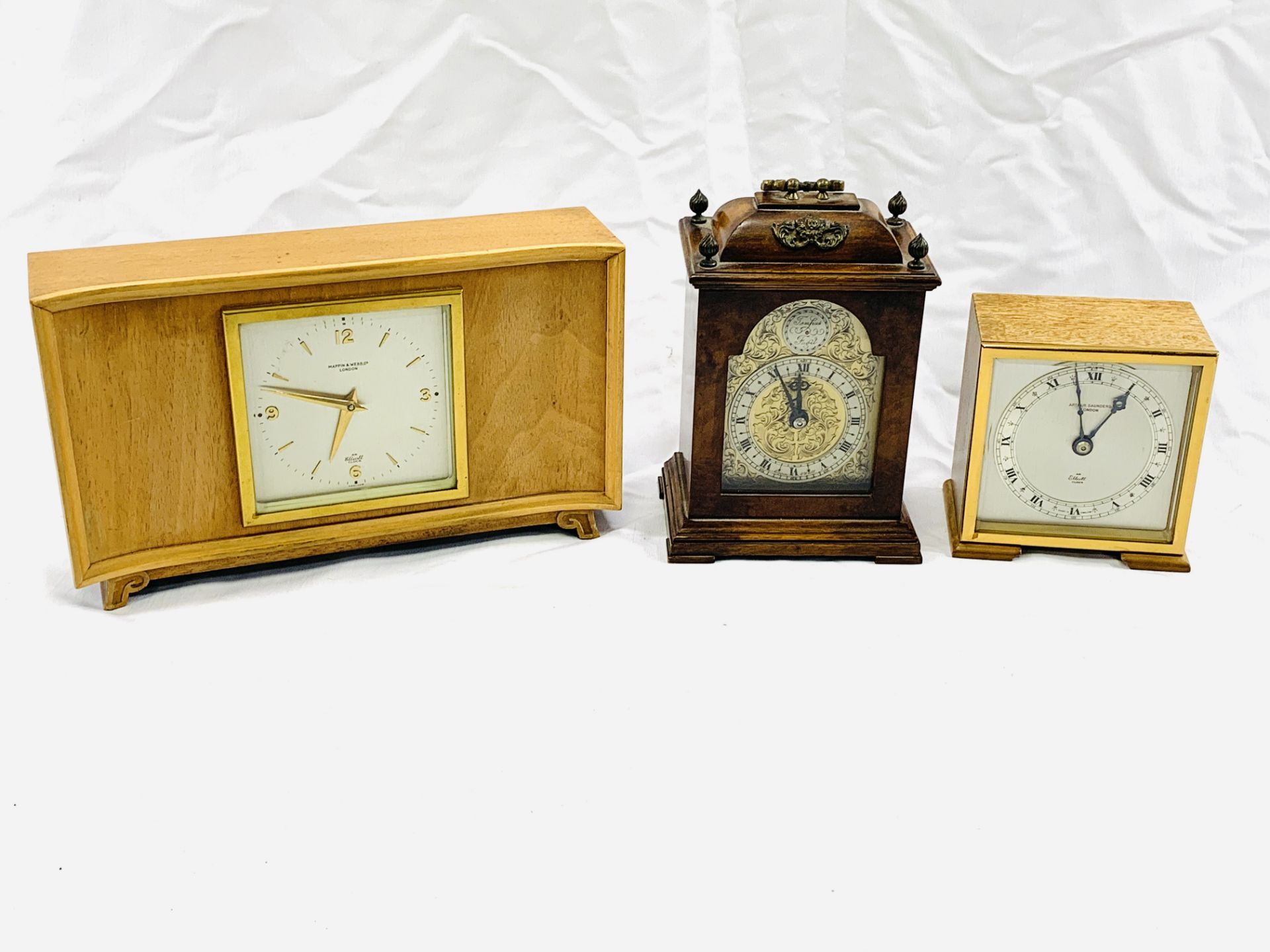 Three wood cased mantel clocks