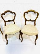 Two pairs of Victorian mahogany framed balloon back dining chairs.