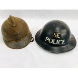 A WWII special constable helmet together with a French WWI helmet