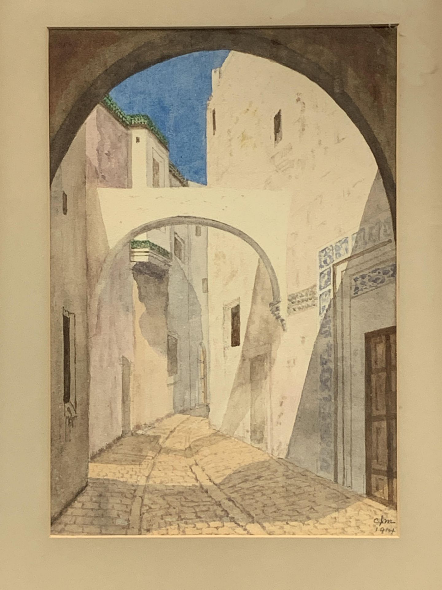 A watercolour of a Middle Eastern street, a lithograph and a map of Cardigan