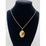 9ct gold locket and chain, and another 9ct gold locket