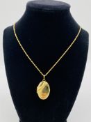 9ct gold locket and chain, and another 9ct gold locket