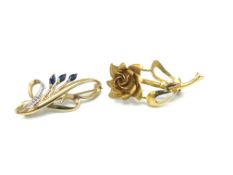 Two 9ct gold floral brooches