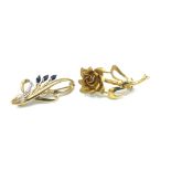 Two 9ct gold floral brooches