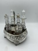 Silver mounted cruet frame, together with six cut glass cruet bottles