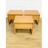 Three oak veneer bedside tables