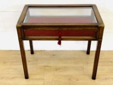 Mahogany glass topped collectors table with drop down front