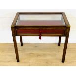 Mahogany glass topped collectors table with drop down front