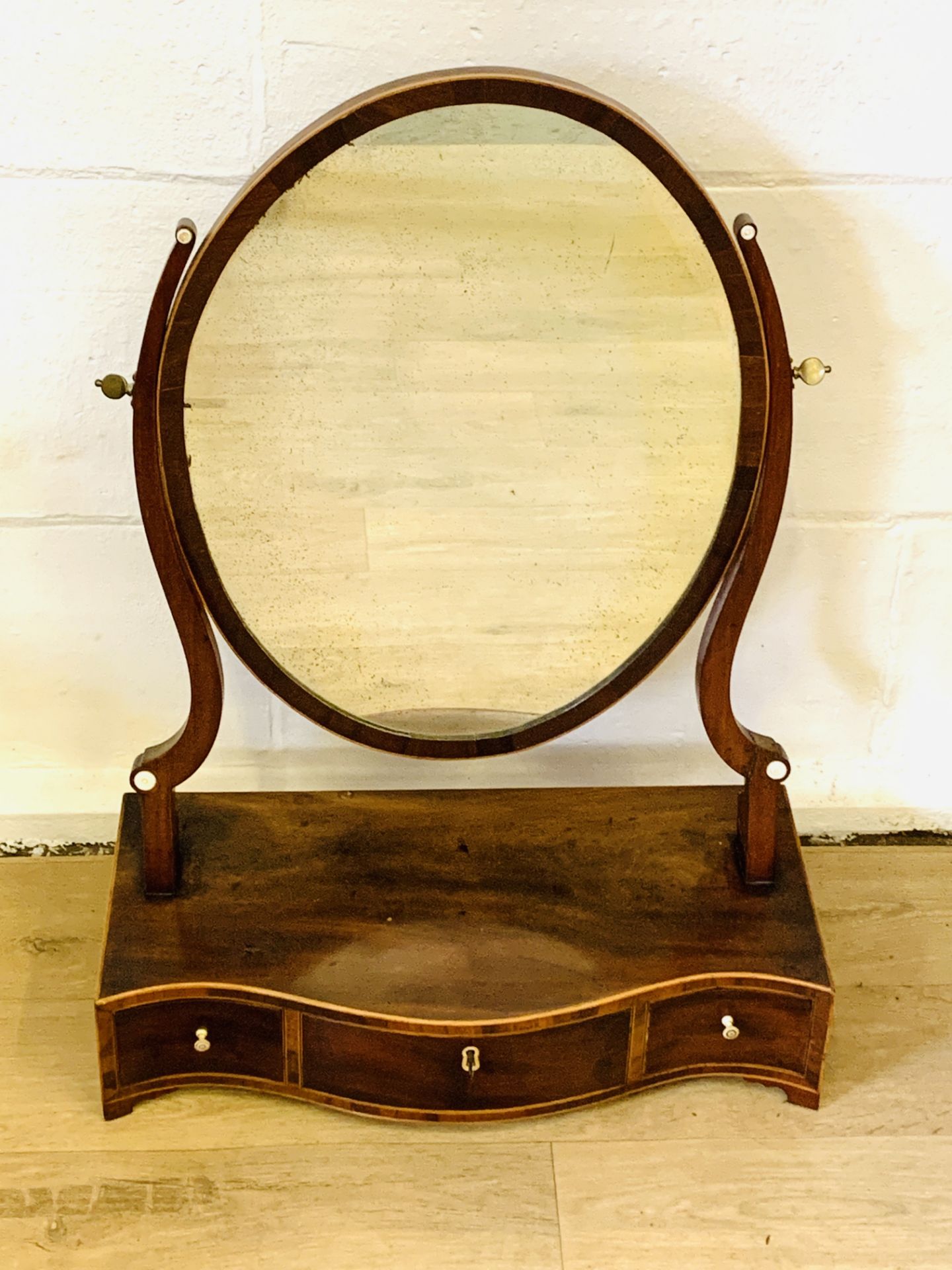 Mahogany veneer oval toilet mirror to three drawers