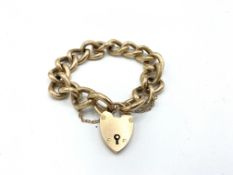 Gold curb and padlock bracelet