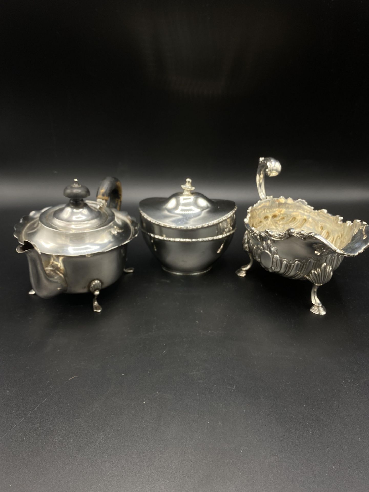 Silver sauce boat, teapot and sugar bowl