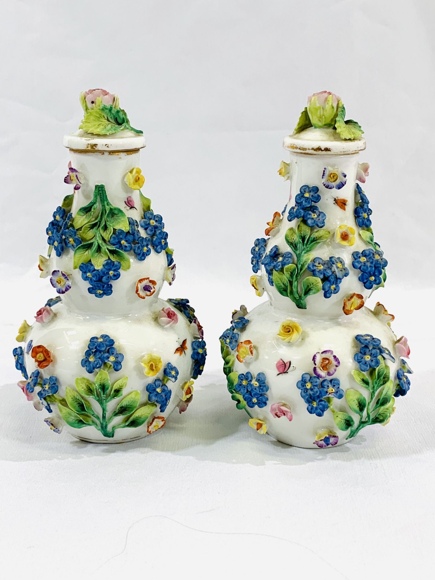 A pair of Augustus Rex porcelain vases