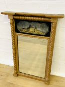 Gilt columned framed overmantle mirror.