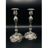A pair of rococo silver candlesticks, by Henry Wilkinson & Co, Sheffield 1875