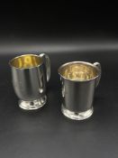 Two small silver tankards