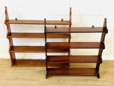Two sets of mahogany wall mounted shelves
