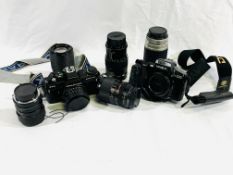 A collection of cameras and lenses