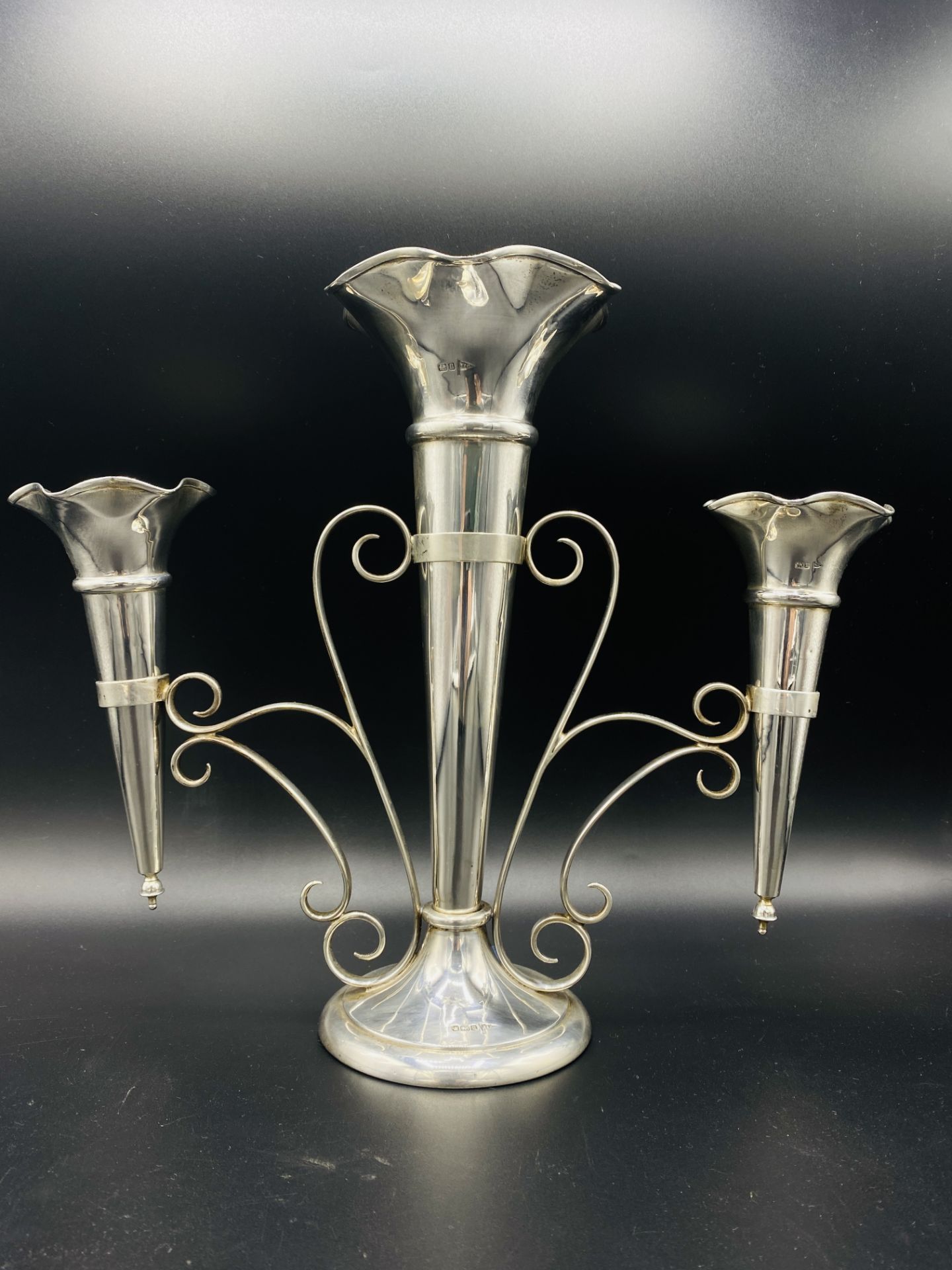 Silver three branch epergne by Walker & Hall, and three silver vases