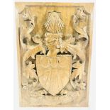 A carved coat of arms.This item carries VAT.