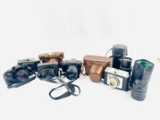 A quantity of cameras and camera equipment