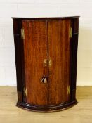 Mahogany bow fronted wall mounted corner cabinet