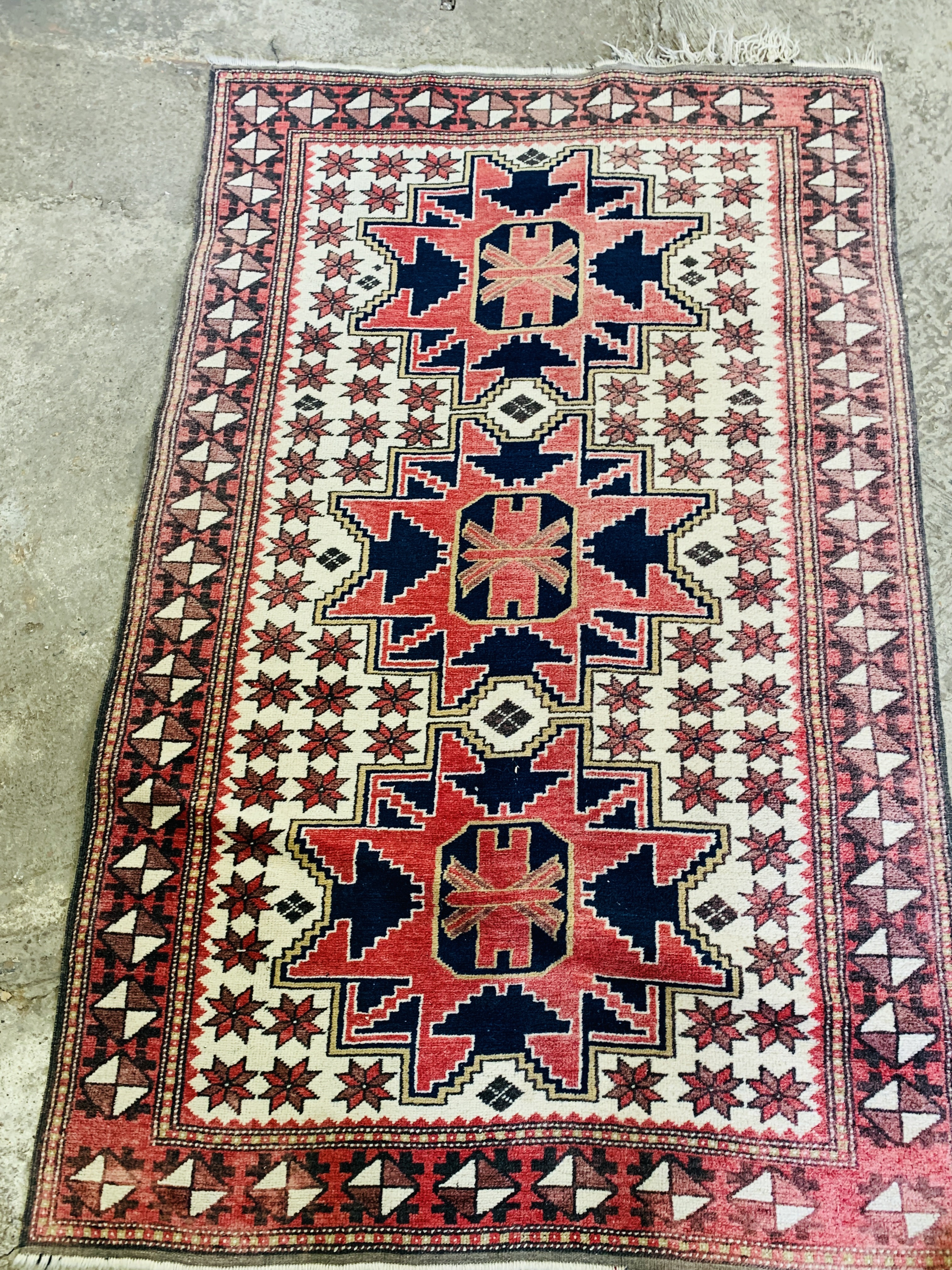 A red ground rug and a runner