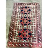 A red ground rug and a runner