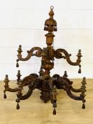 Carved wood chandelier. This item carries VAT.