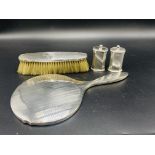 Silver dressing table mirror, brush, and pair of pepper pots