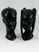 Two ebonised wood heads