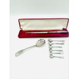 Small berry spoon hallmarked London 1833, and other silver items