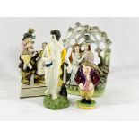 A Crown Derby figure together with three Staffordshire figures