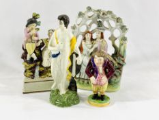 A Crown Derby figure together with three Staffordshire figures