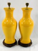 A pair of Oriental monochrome yellow vases mounted as table lamps
