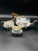 Silver teapot together with sugar bowl and milk jug all by S W Smith & Co