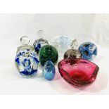 A collection of glass paperweights