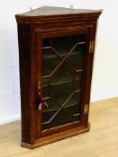 Mahogany glass fronted corner display cabinet