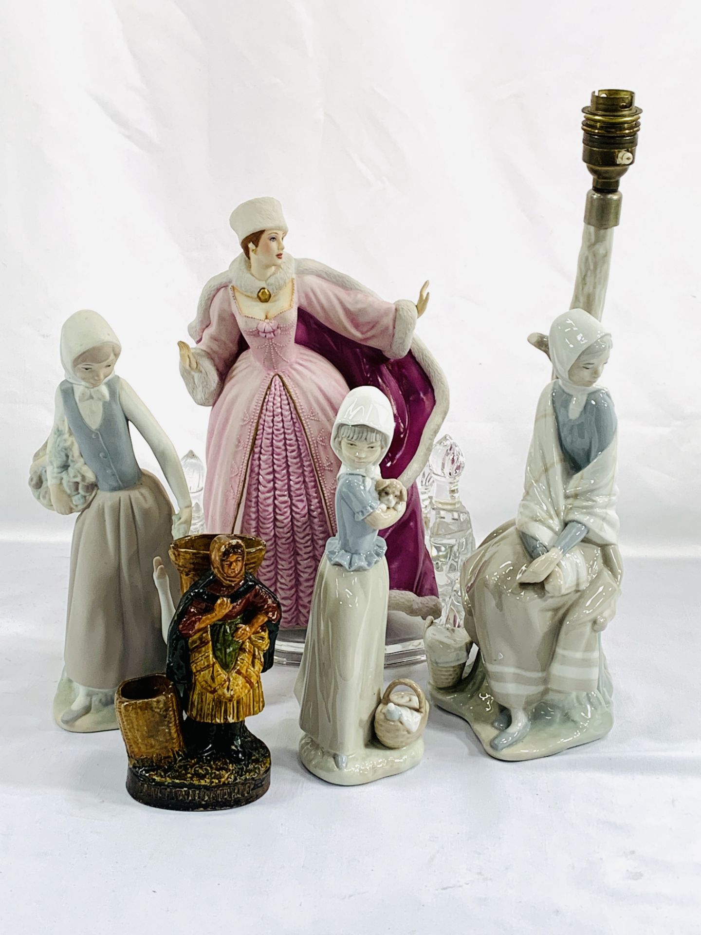 A Lladro table lamp, a Lladro figure and other figures