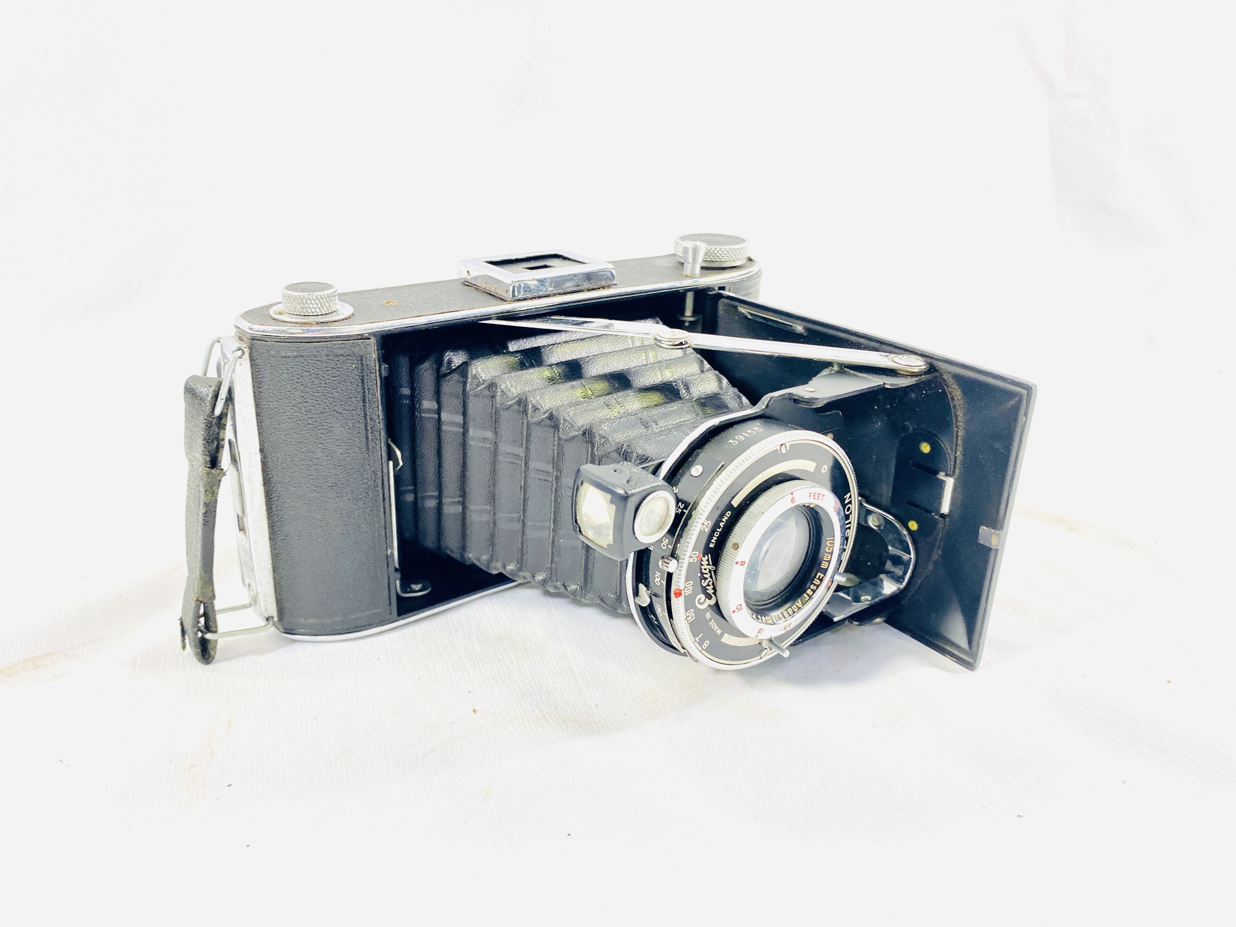 An 8mm camera together with two other cameras