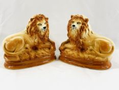 A pair of Victorian Staffordshire recumbent lions