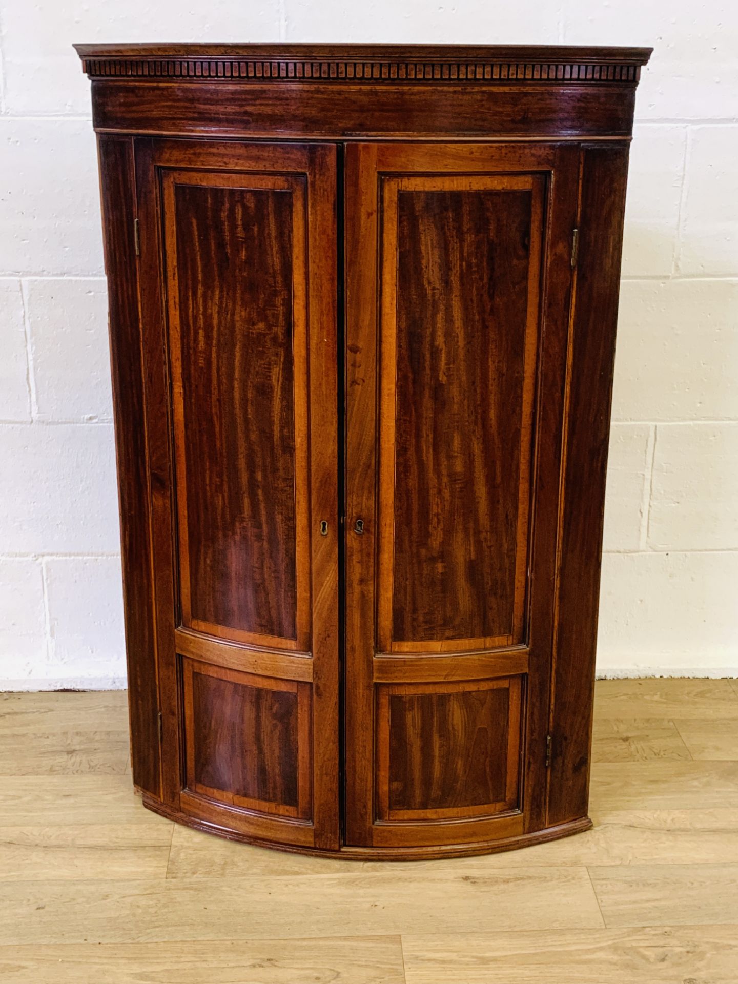 Bow fronted corner cabinet