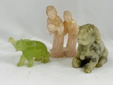 A carved jade elephant, a quartz carving and a soapstone Dog of Fo