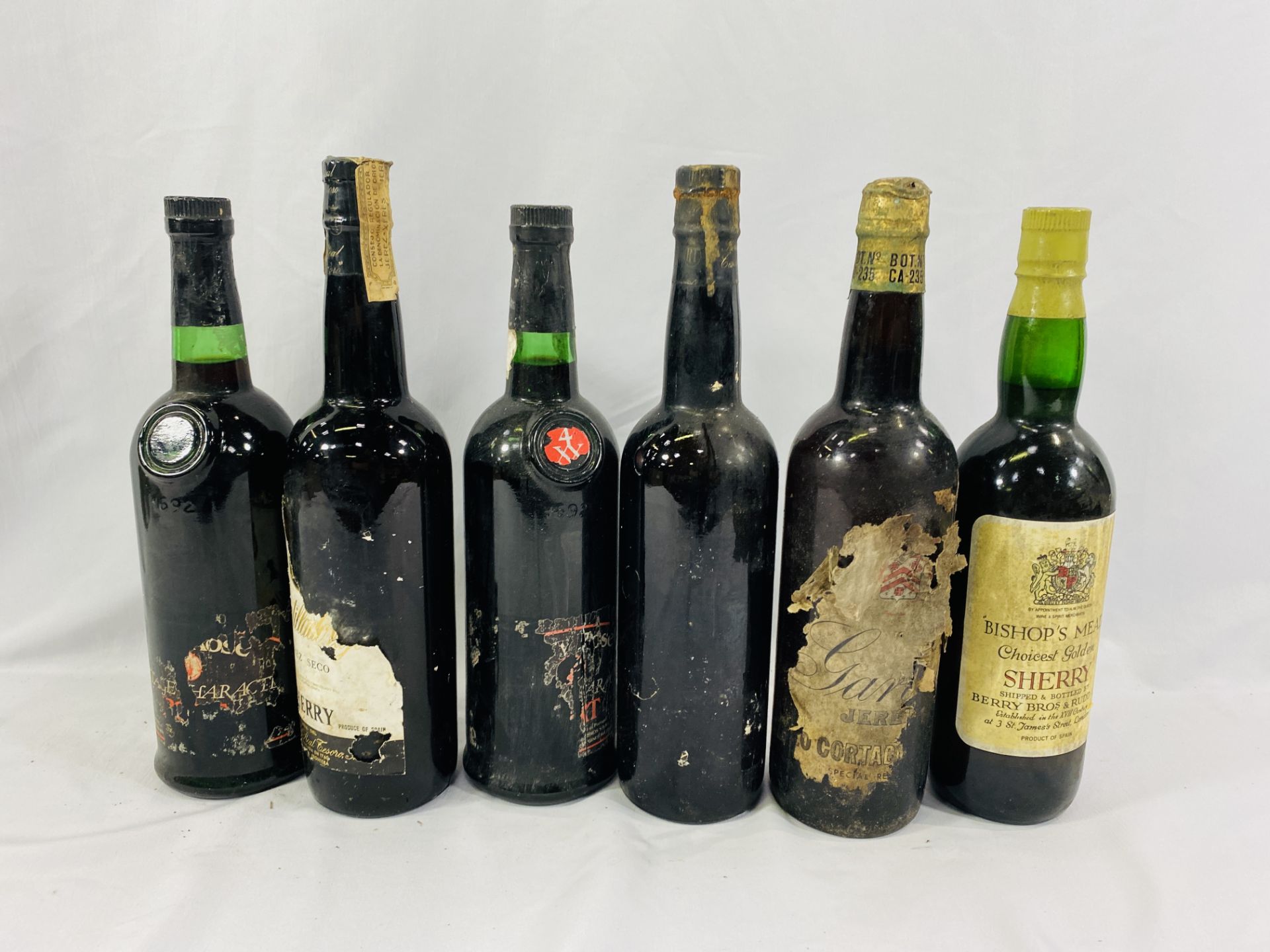 Three bottles of sherry and three of port